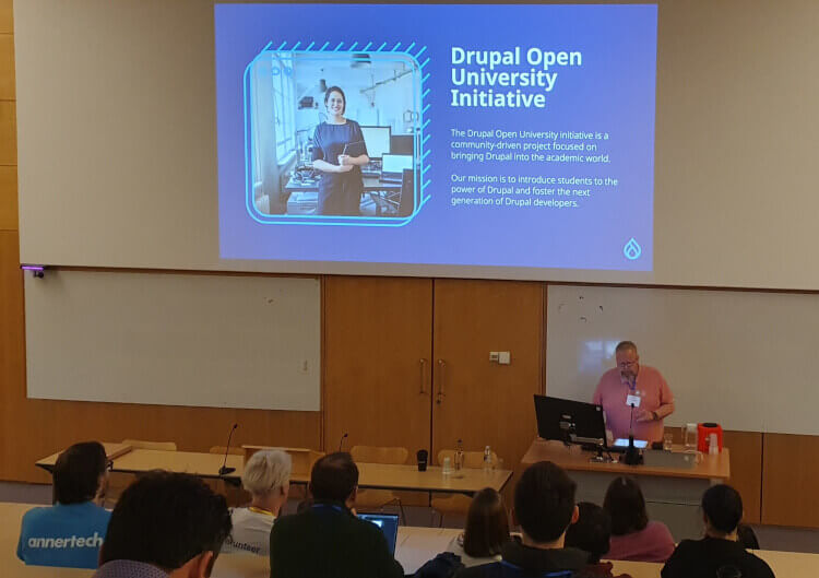 An audience of 9 people looking at drupalviking, who is talking about Drupal Open University.