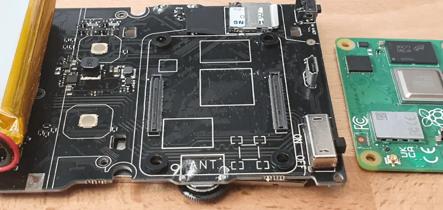 The PCB of the GPi Case 2, showing the Raspberry Pi CM$ next to it in the correct orientation.